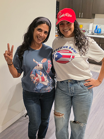 Two ladies celebrating the Super Bowl in Puerto Rico gear.